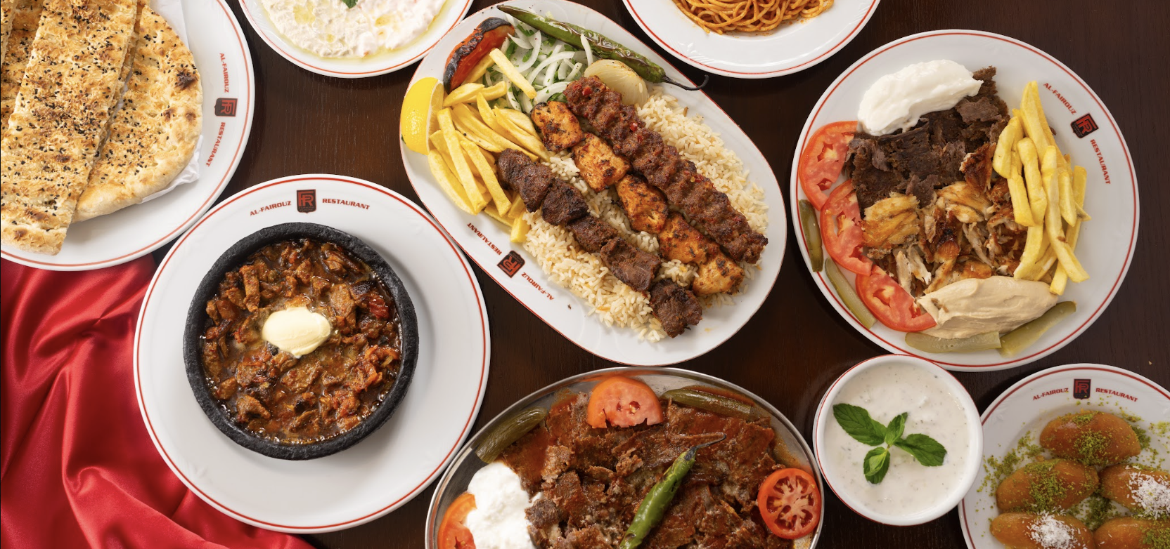 A spread of Al-Fairouz dishes — mixed grill, shawarma, tagines and mezze
